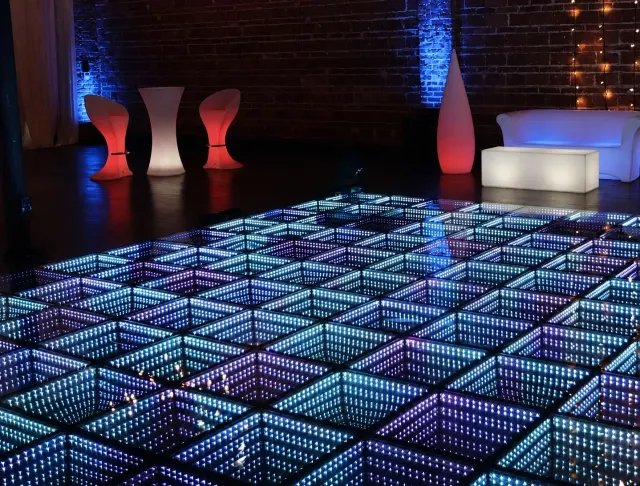 Infinity LED dance floor inside an after-dark lounge installation