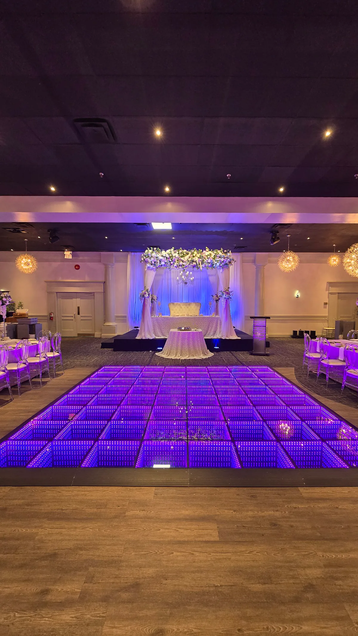 Infinity LED floor centered in a wedding ballroom