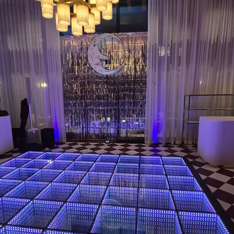 Blue infinity LED dance floor in an art-deco event space