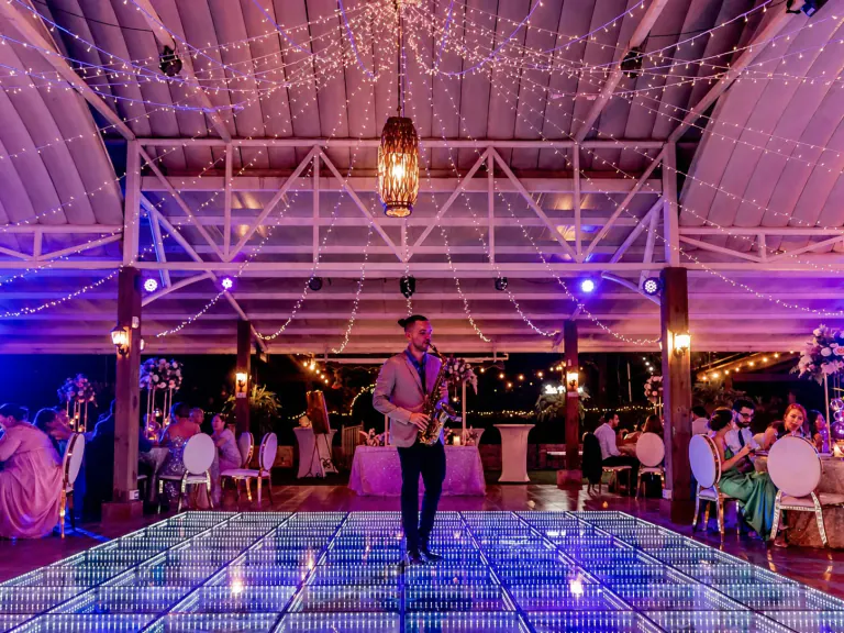 Saxophone player performing on an infinity LED dance floor