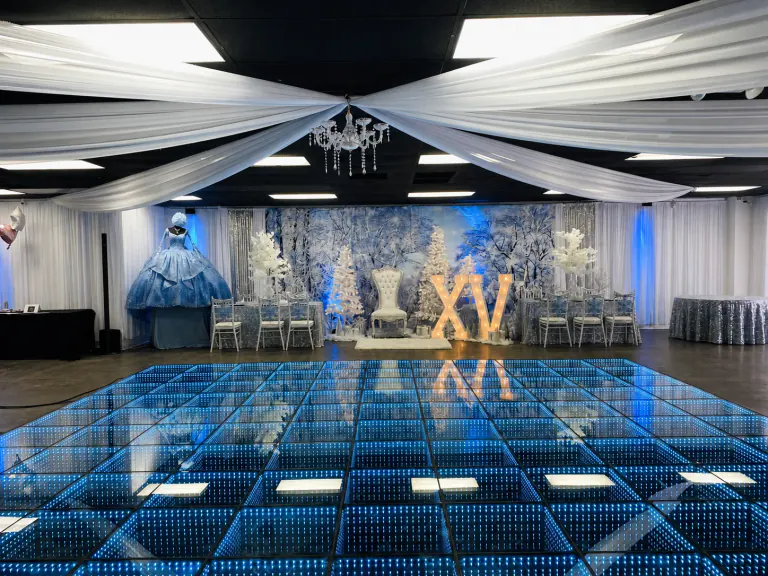 Blue infinity LED floor facing a winter themed XV stage